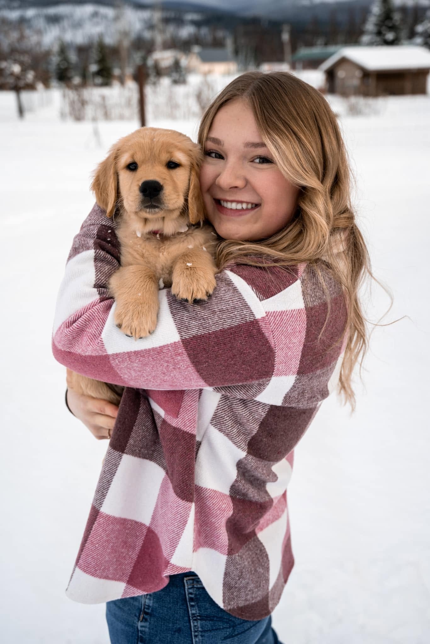 Mallory outside in the winter snow with her dog
