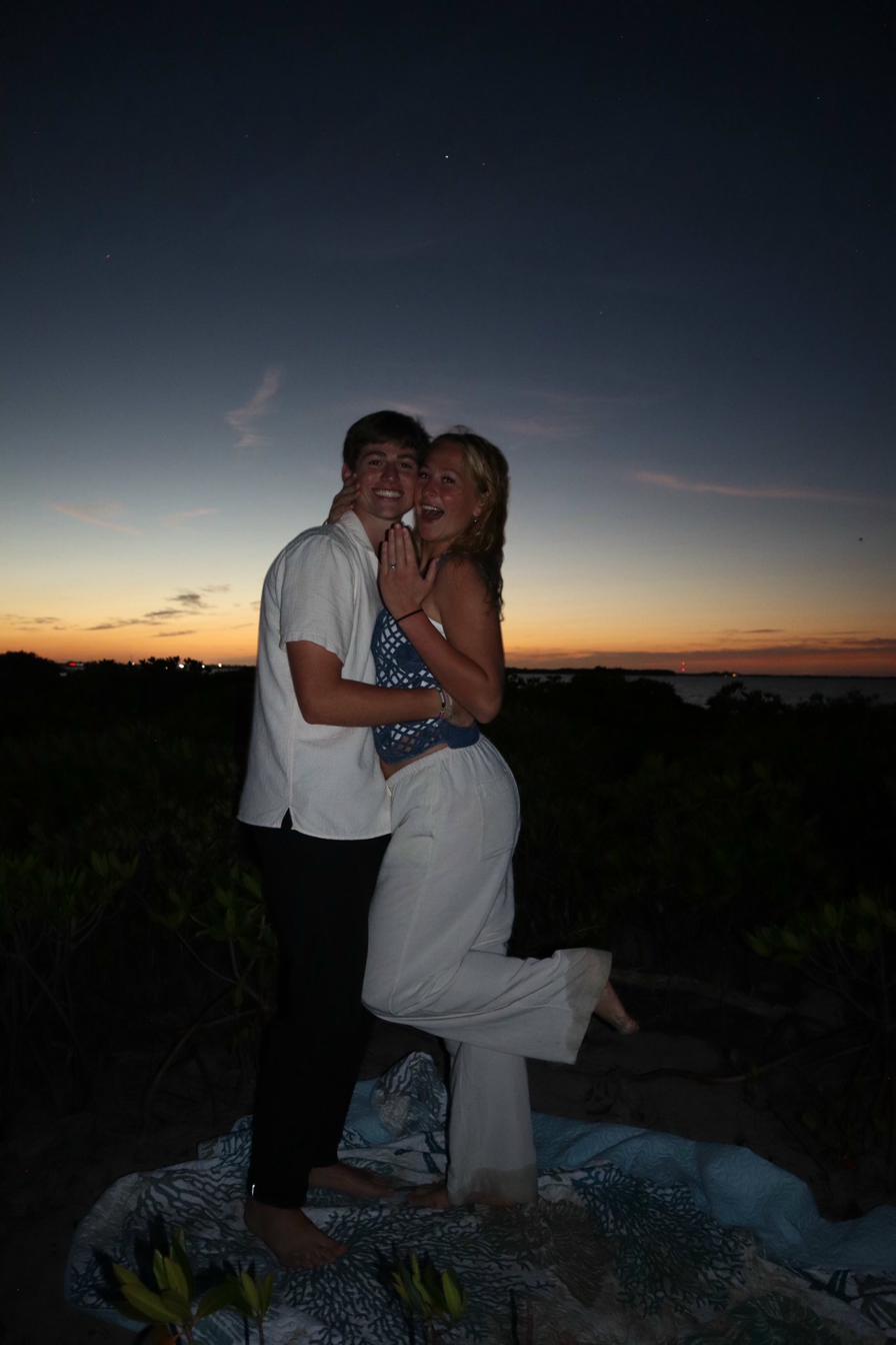 Tommy and Markynn after the proposal at sunset